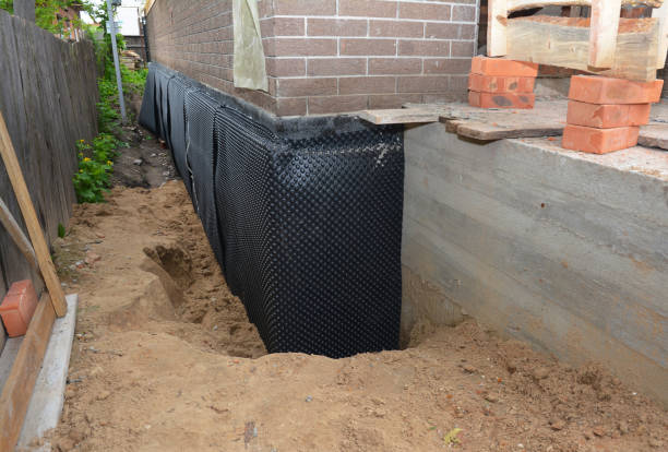 Happy homeowners after waterproofing job in New Marshfield